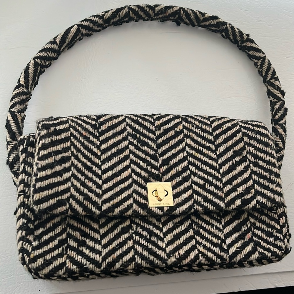 ANINE BING Nico shoulder bag in fishbone patterned black and cream wool